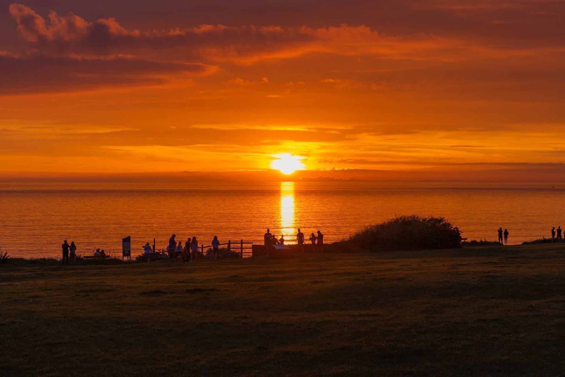 Orange sun setting over Woolacombe beach
